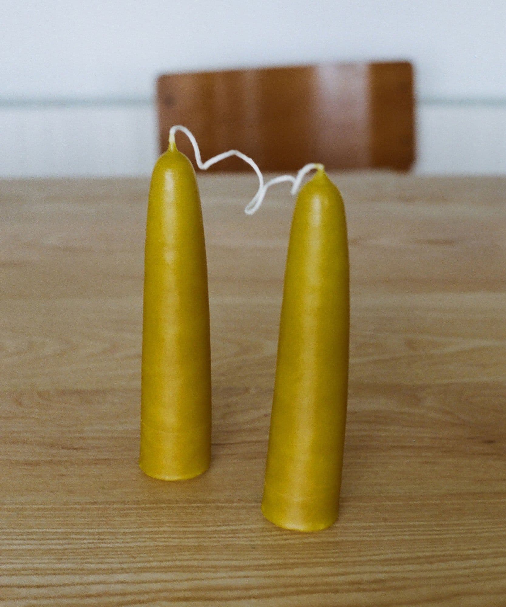 The Jolene bakery x Gina Portman candles on a wooden table