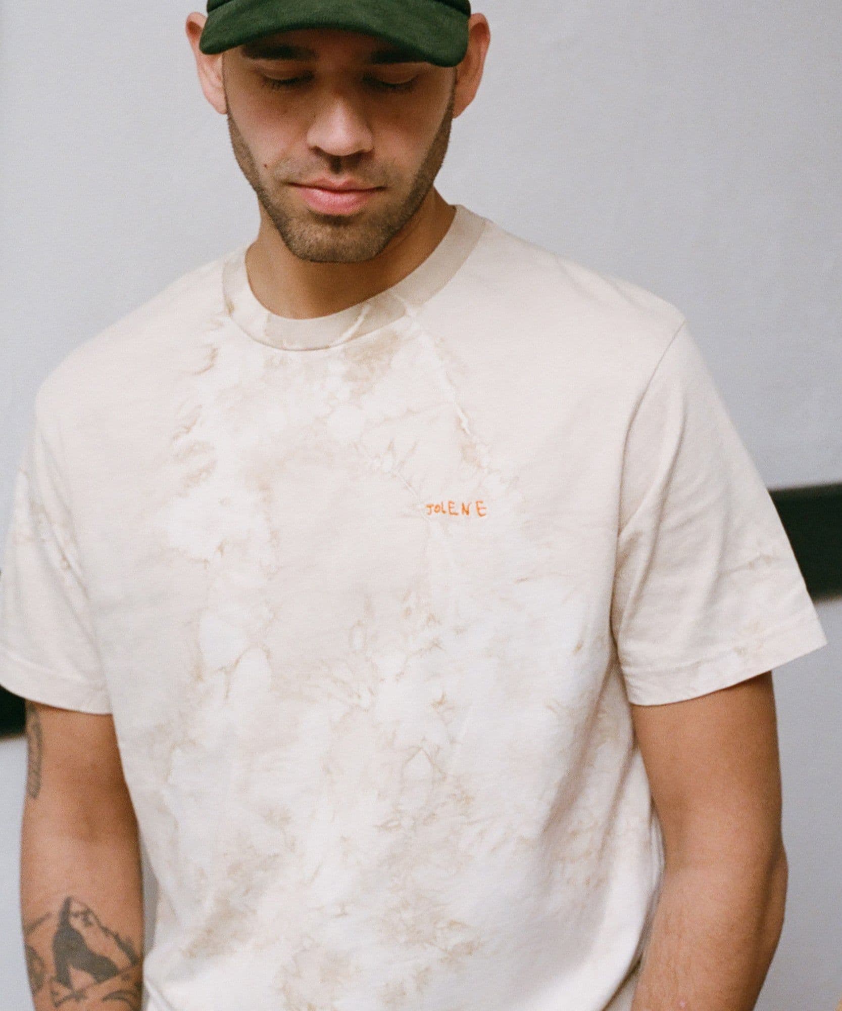 The Jolene coffee dyed t shirt being modelled by one of our team who is also wearing the green cord baseball cap