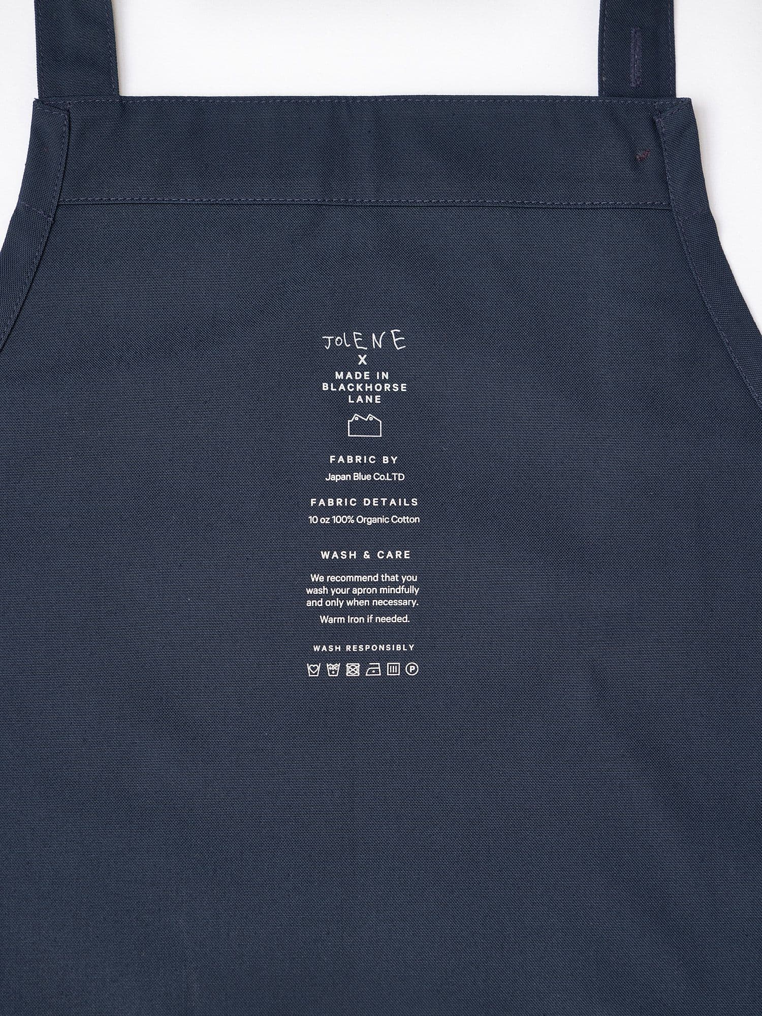 The Jolene Bakery house apron pictured here in the navy colour