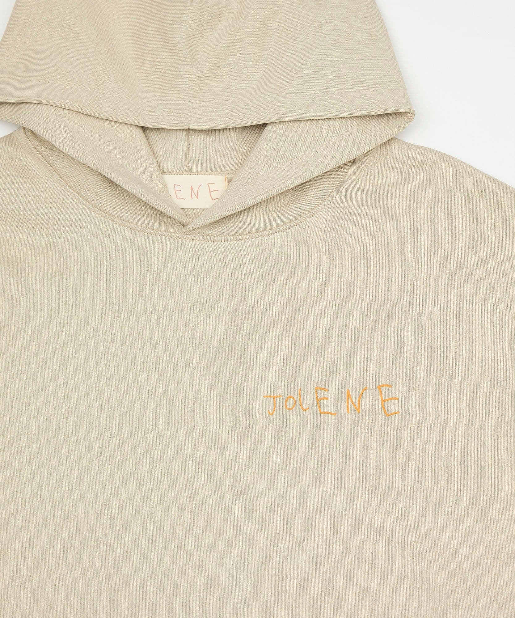 The jolene bakery J face hoodie in stone on a white background