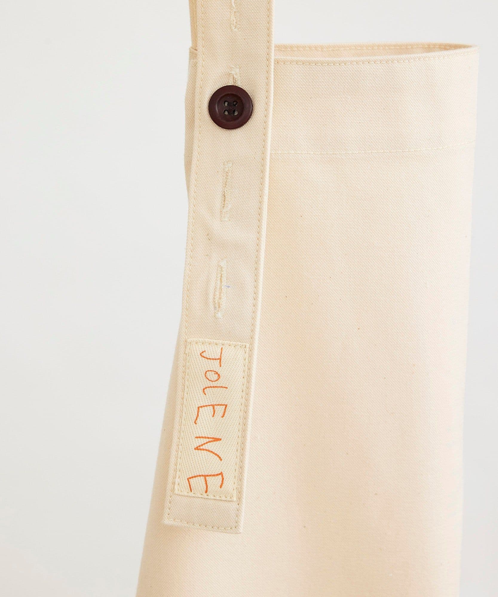 Jolene Bakery house apron pictured here in the stone colour