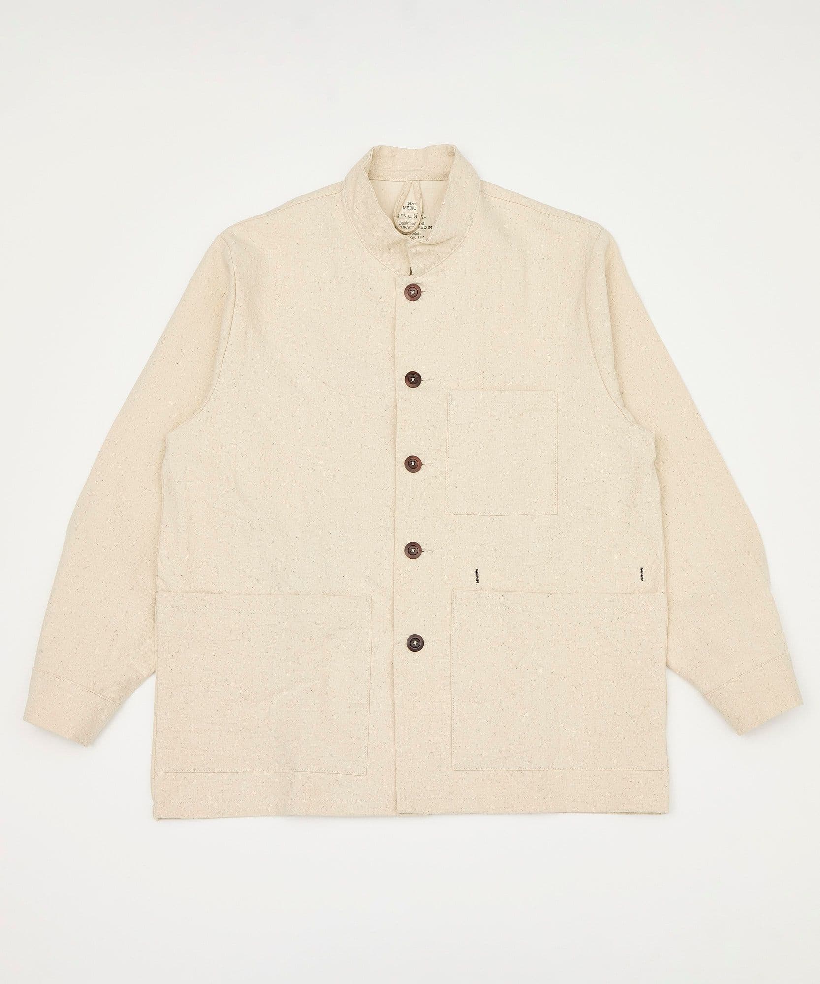 The Jolene x Venture Foreman jacket. A pink workwear jacket with buttons down the front pictured here on one of our team.