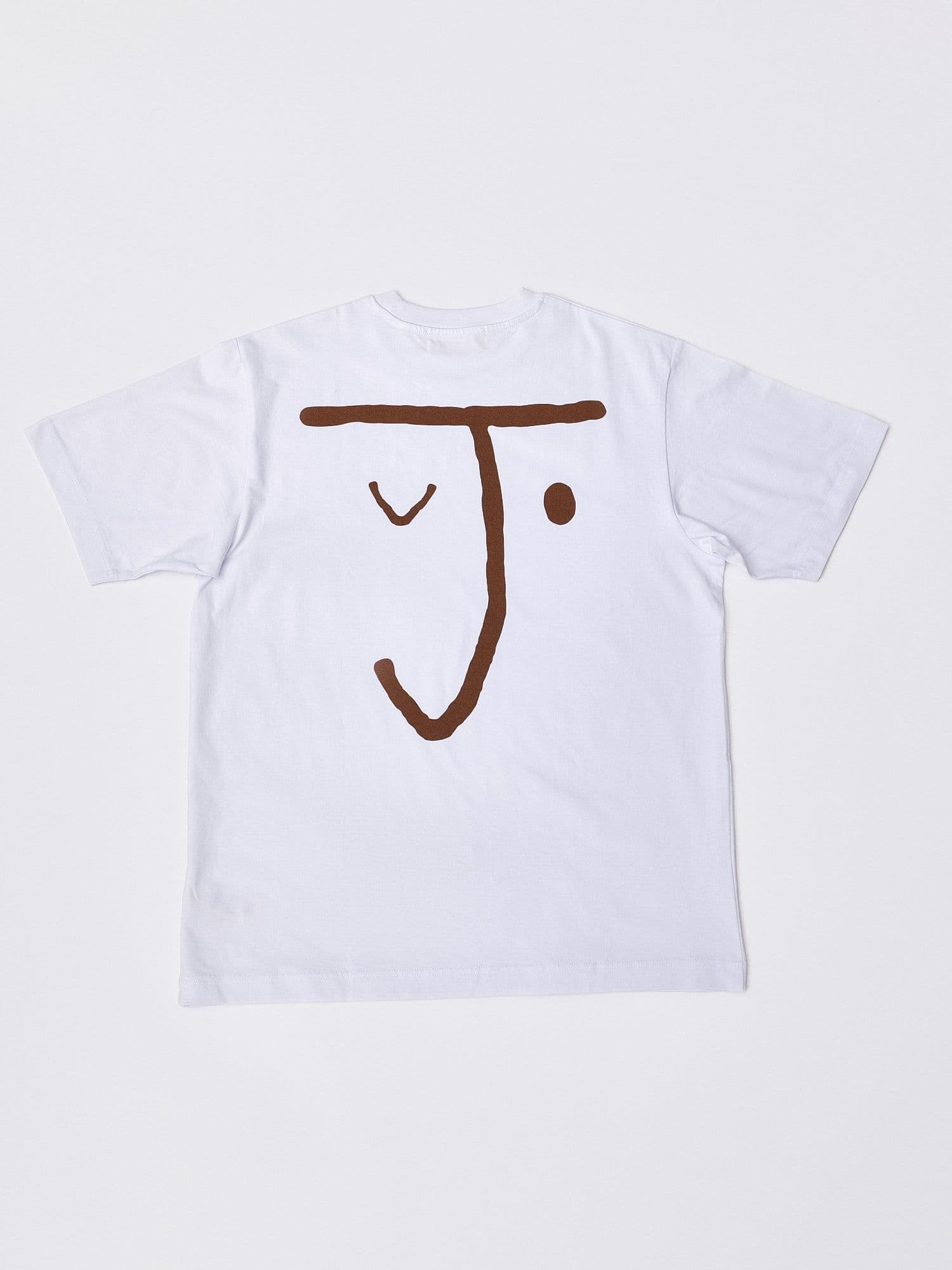 The Jolene bakery J Face short sleeve t shirt. The t shirt is white and has the J face logo in brown