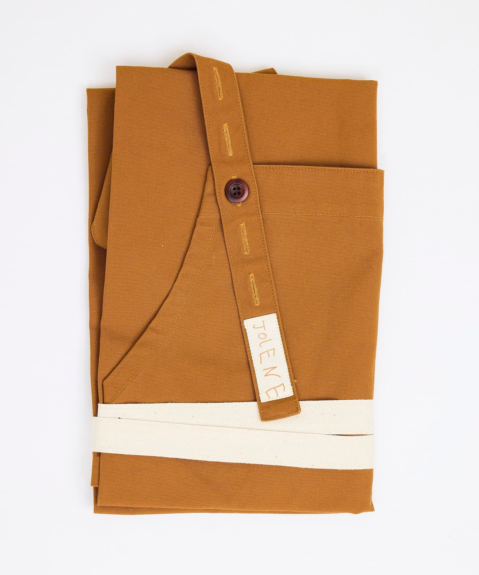 The Jolene Bakery house apron pictured here in the caramel colour