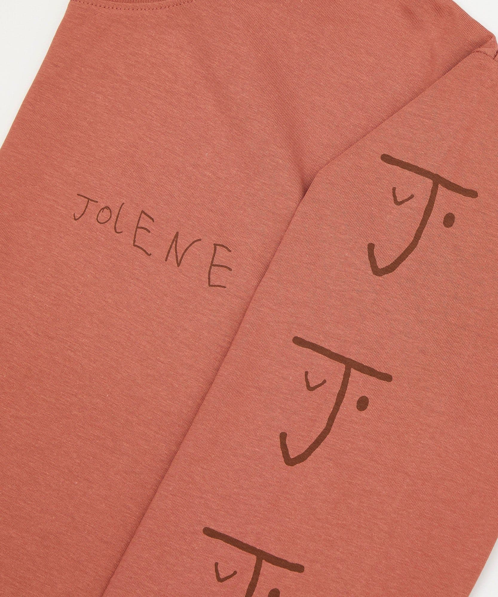 The Jolene bakery long sleeve t shirt showing the J face logo down the sleeve