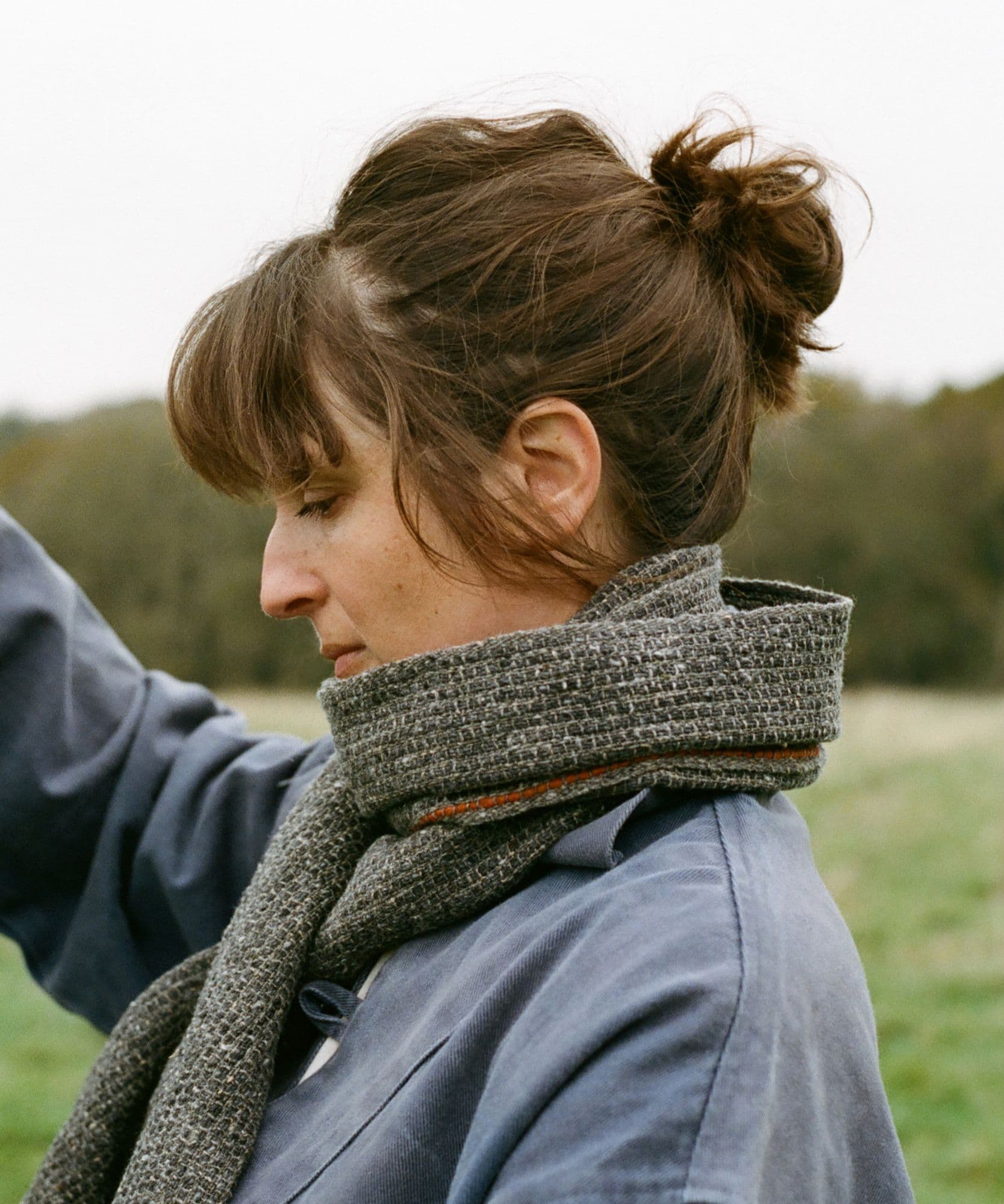 A female model wears the Jolene bakery Scarf x Mourne Textiles