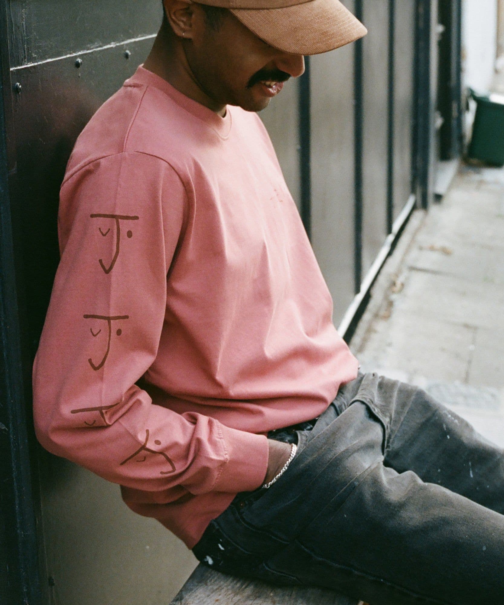 One of the Jolene bakery team wearing the jolene bakery long sleeve t shirt in pink