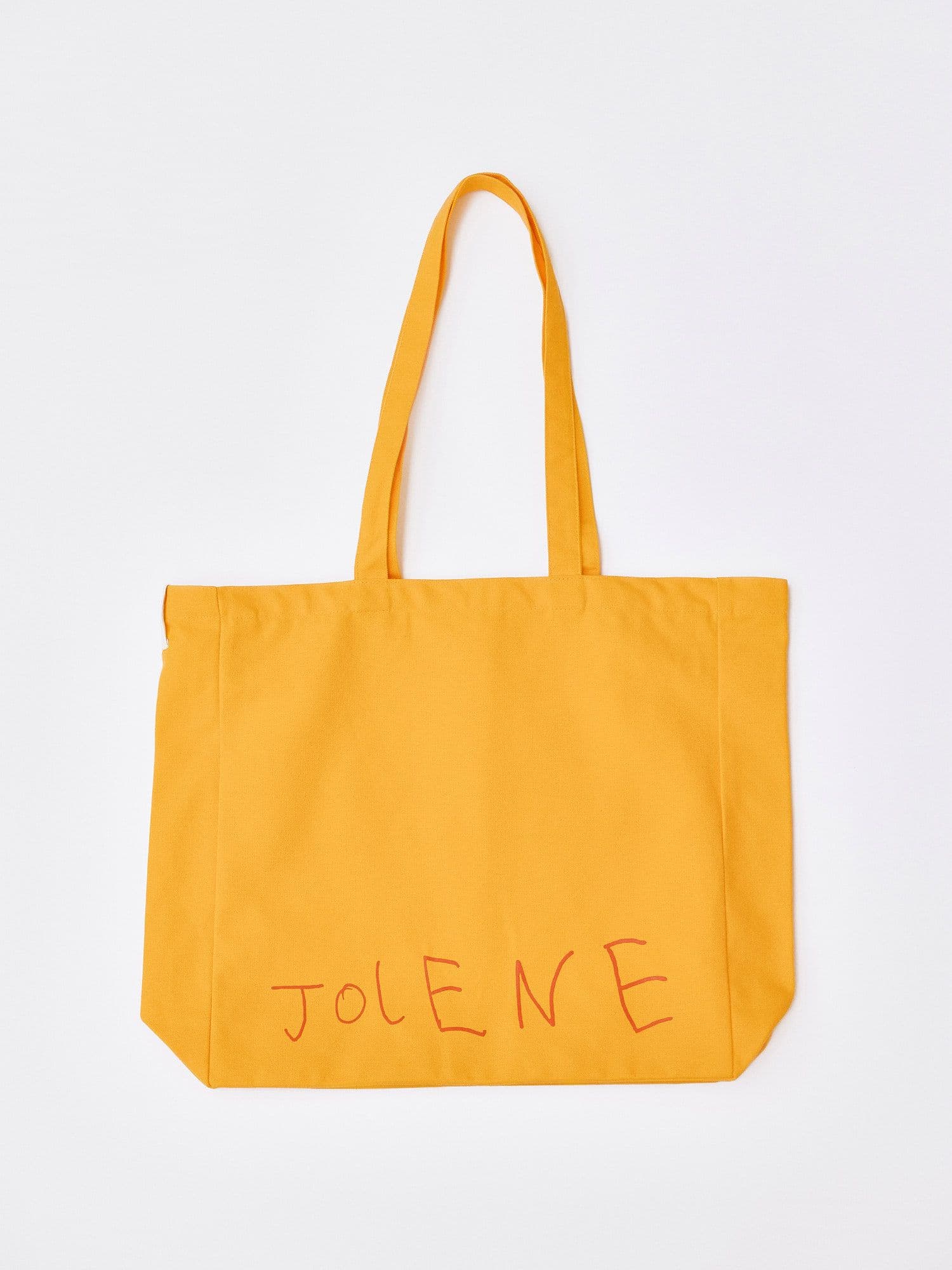 The Jolene Small Tote in yellow pictured on a white background